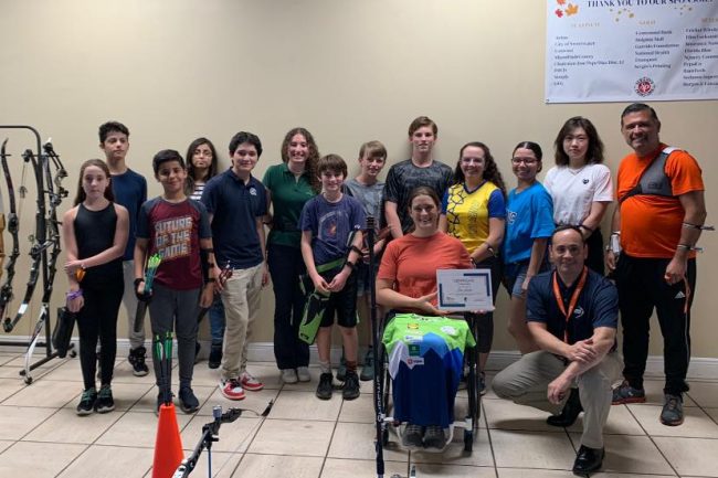 Group of archers at the workshop with para archer