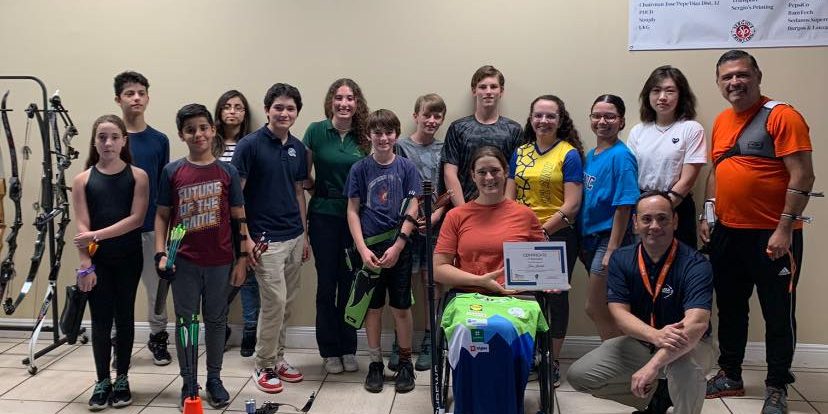 Group of archers at the workshop with para archer